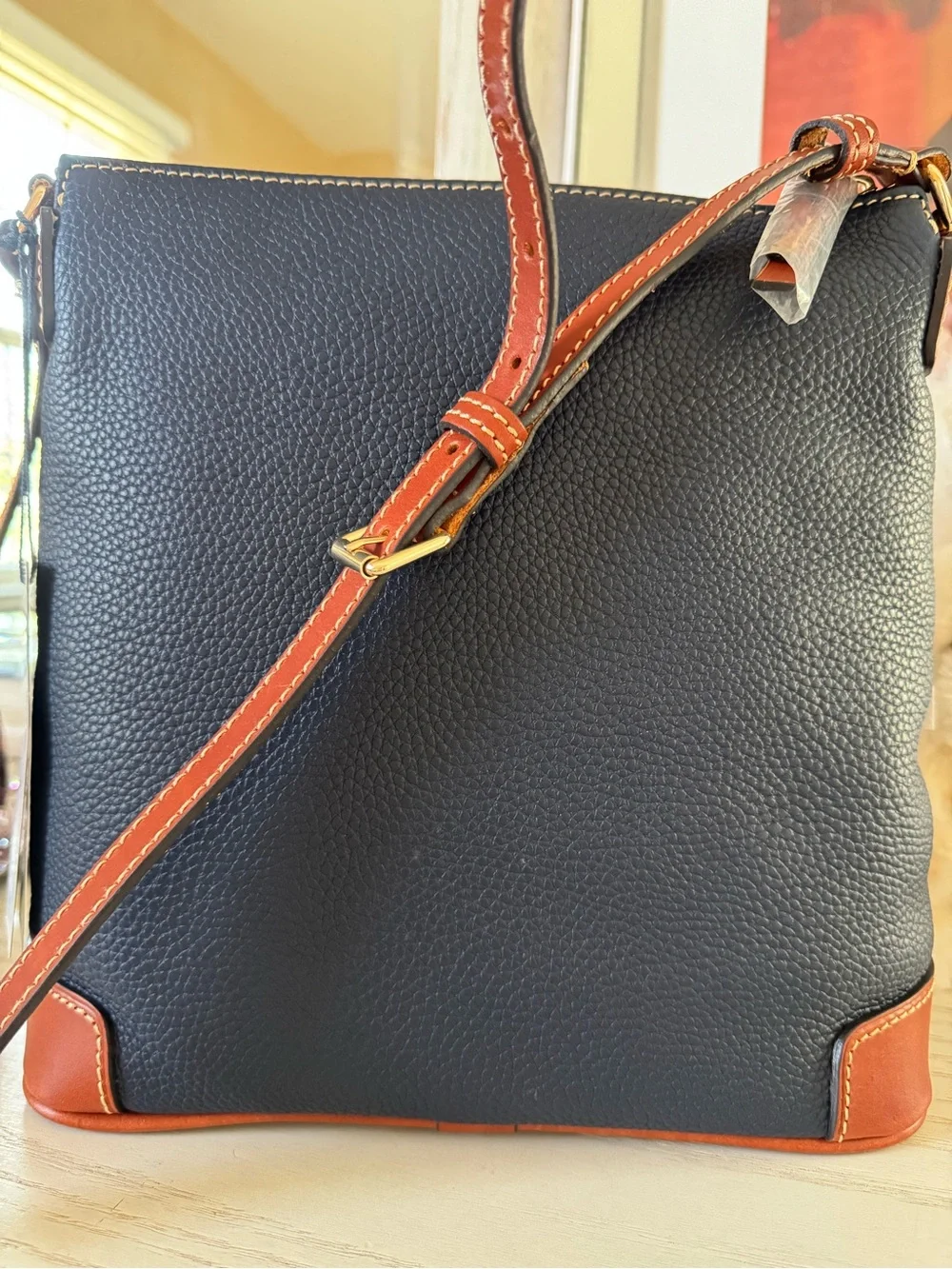 Dooney & Bourke Navy Pebble Leather Crossbody with Brown Trim and Gold Hardware